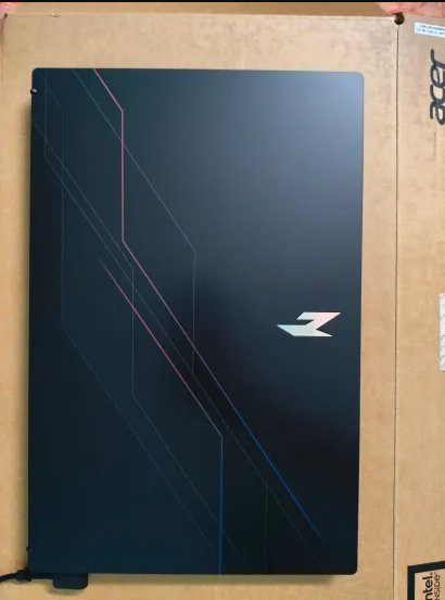 Acer Nitro gaming laptop lid on top of its retail box during unboxing