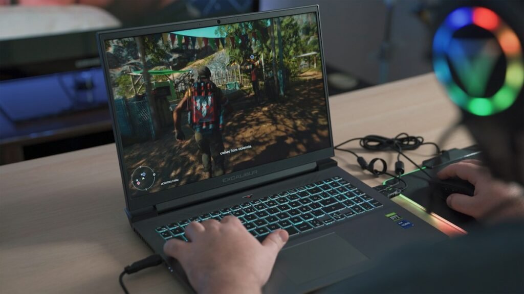 Person playing a AAA game on a gaming laptop to check real-world gaming performance