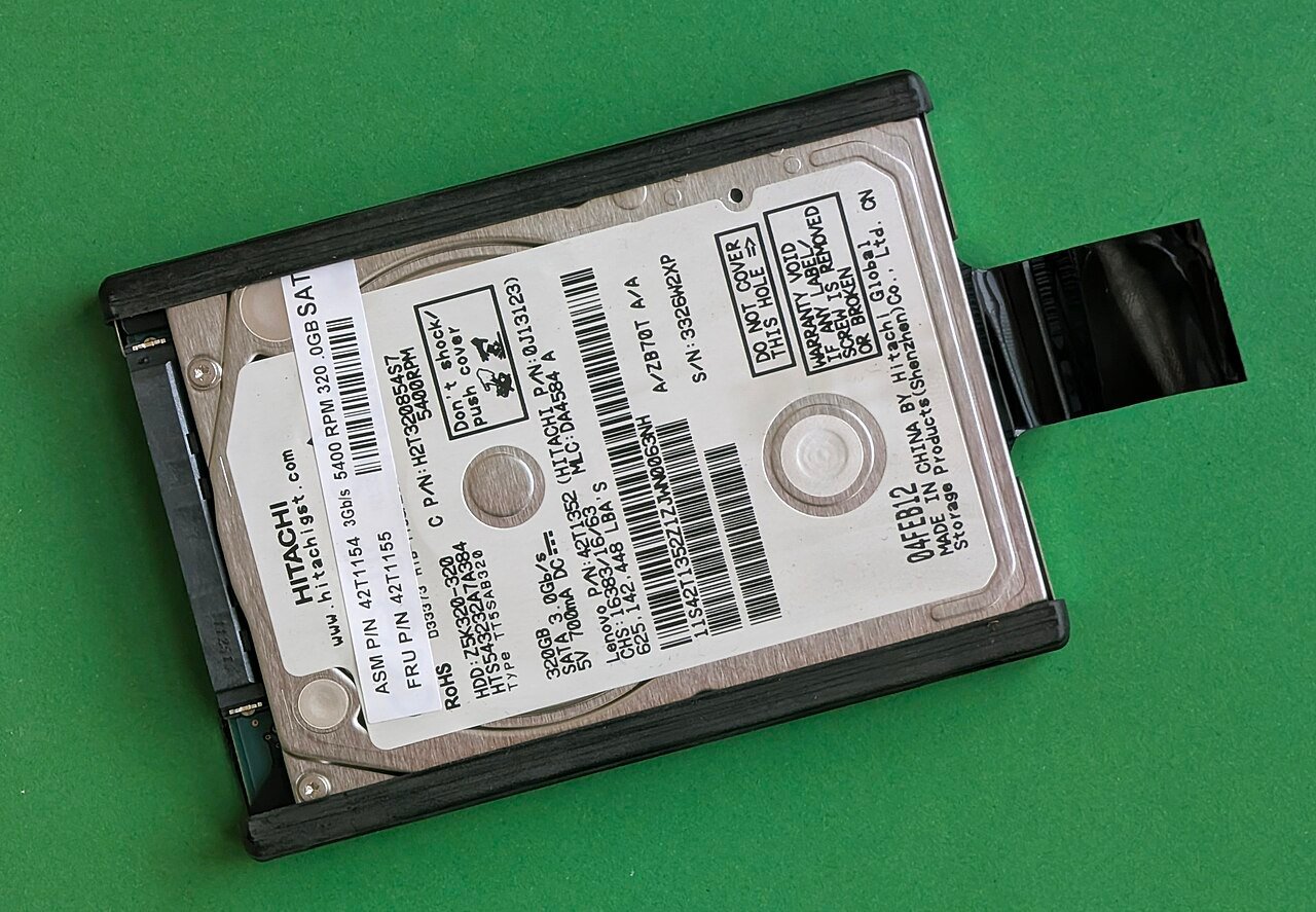 2.5 inch laptop hard disk drive in its drive caddy