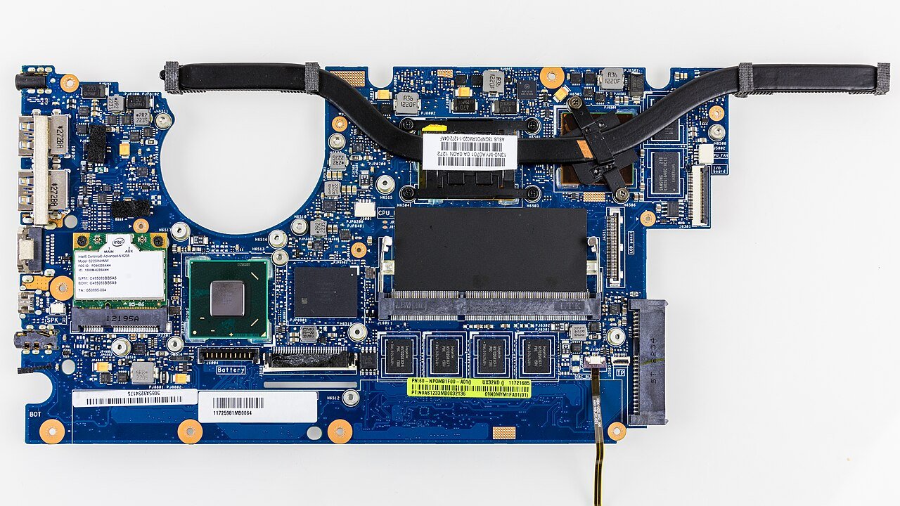 Laptop motherboard with soldered memory chips and an SO-DIMM RAM slot