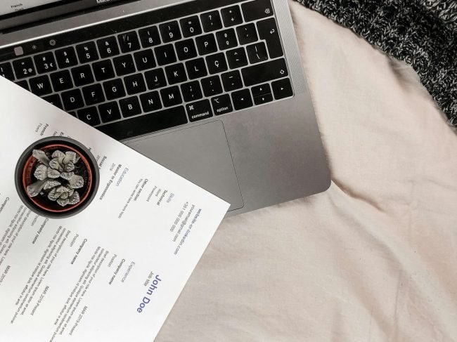 A4 printed sheet next to a laptop keyboard for size scale